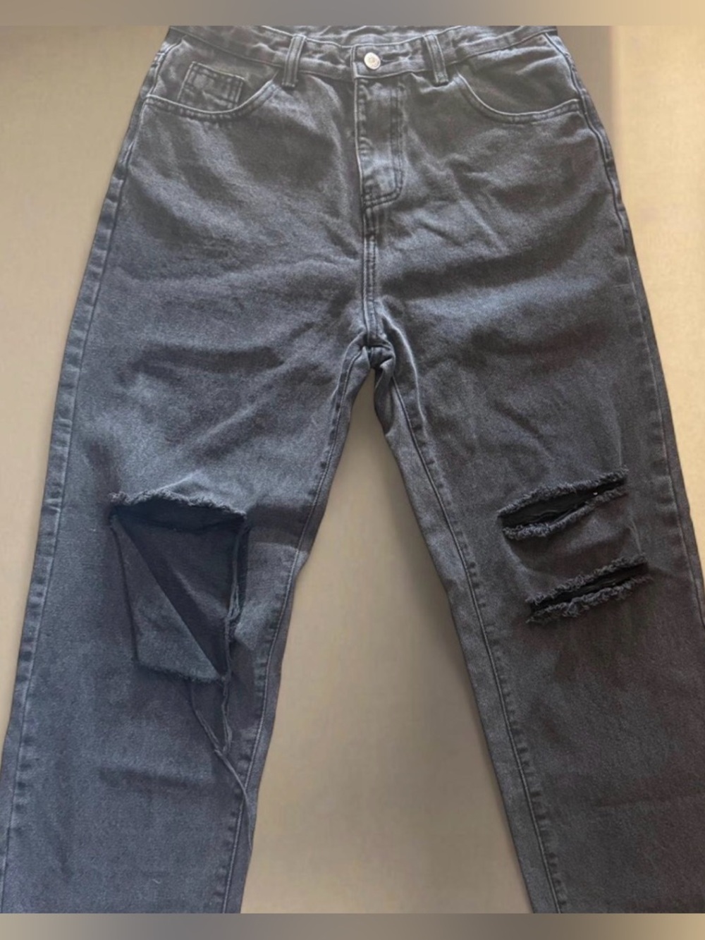 Black ripped straight leg jeans with a distressed look #denim #distressed